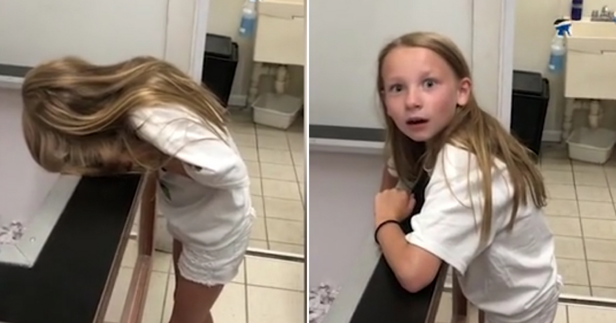Little girl looks down into crate of sold puppy, and then finds out it is hers