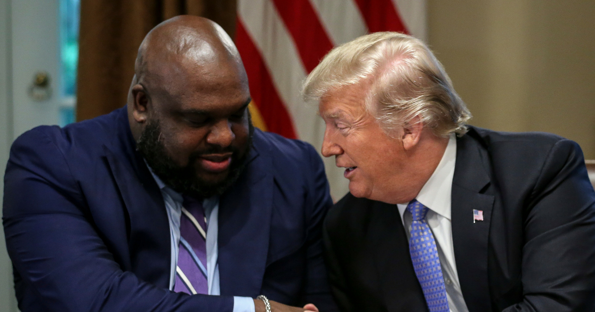President Donald Trump shakes hands with Senior pastor John Gray during a meeting with inner city pastors