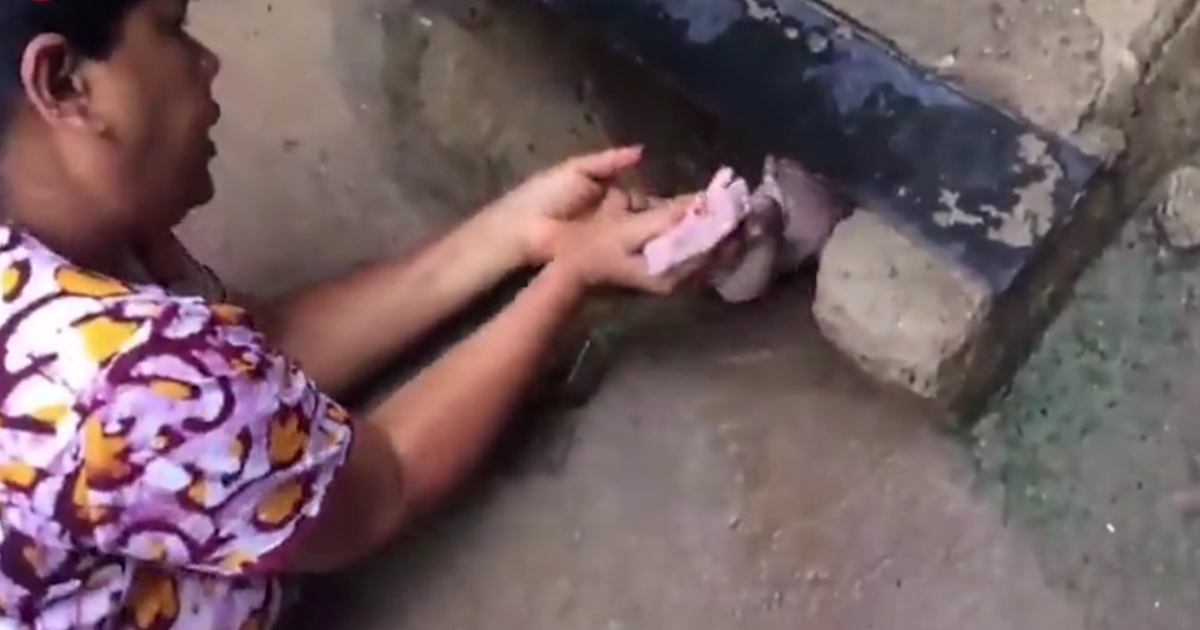 Woman rescues baby from drain