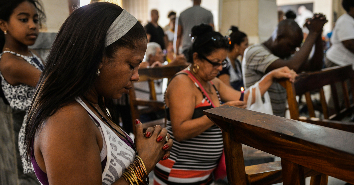 Women kneeling and praying