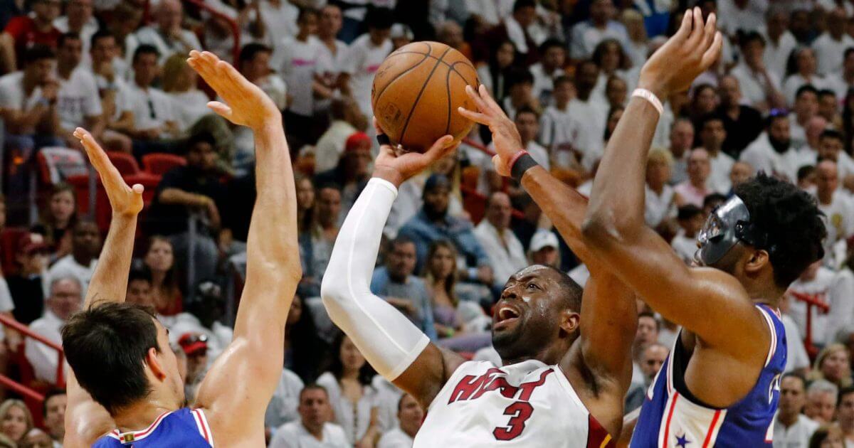 Miami Heat guard Dwyane Wade (3) shoots and scores in Game 4 of a 2018 first-round NBA playoff series in Miami.