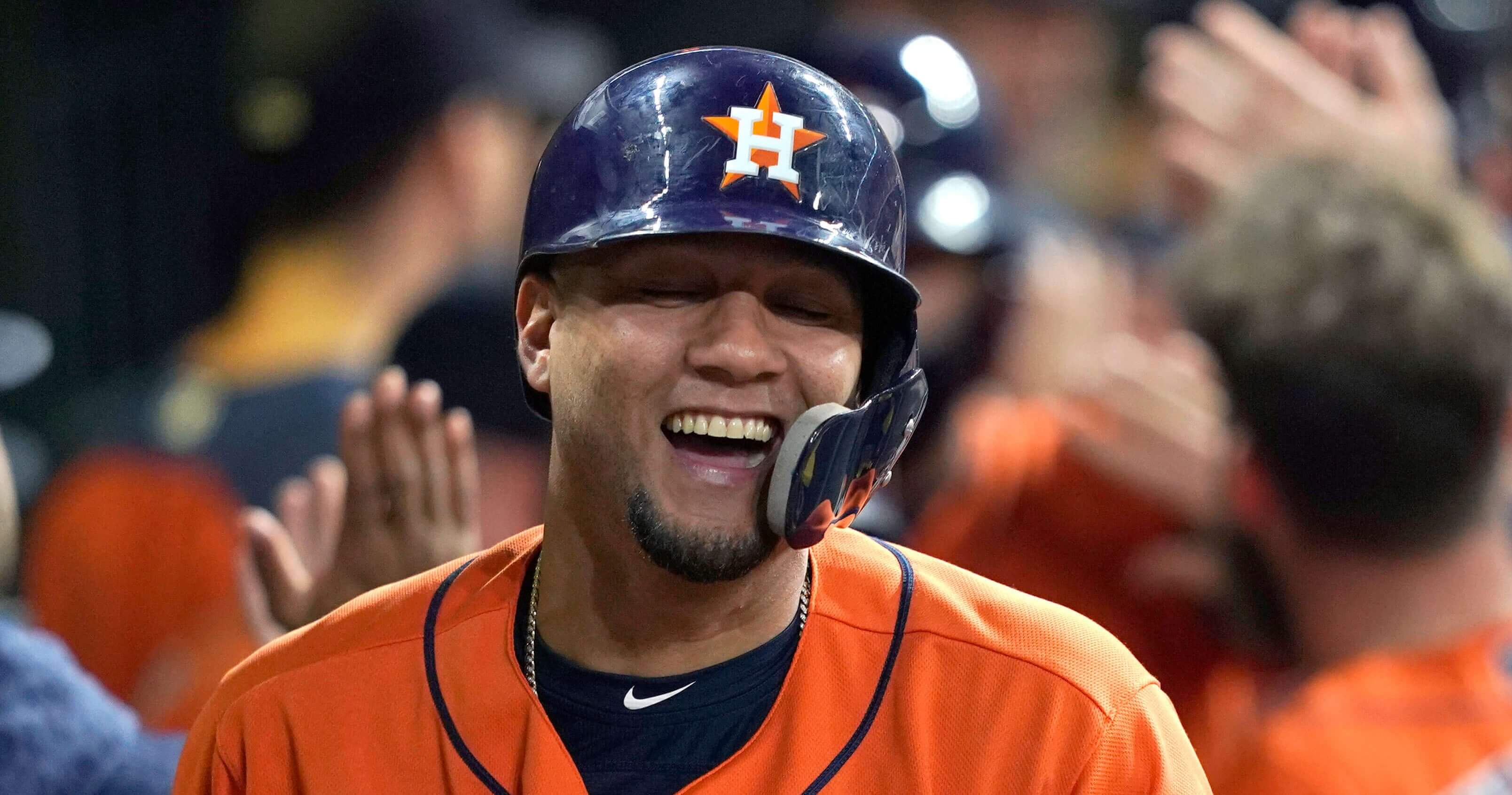 The Astros' Yuli Gurriel celebrates in the dugout after hitting a grand slam against the Los Angeles Angels during the first inning Friday in Houston.