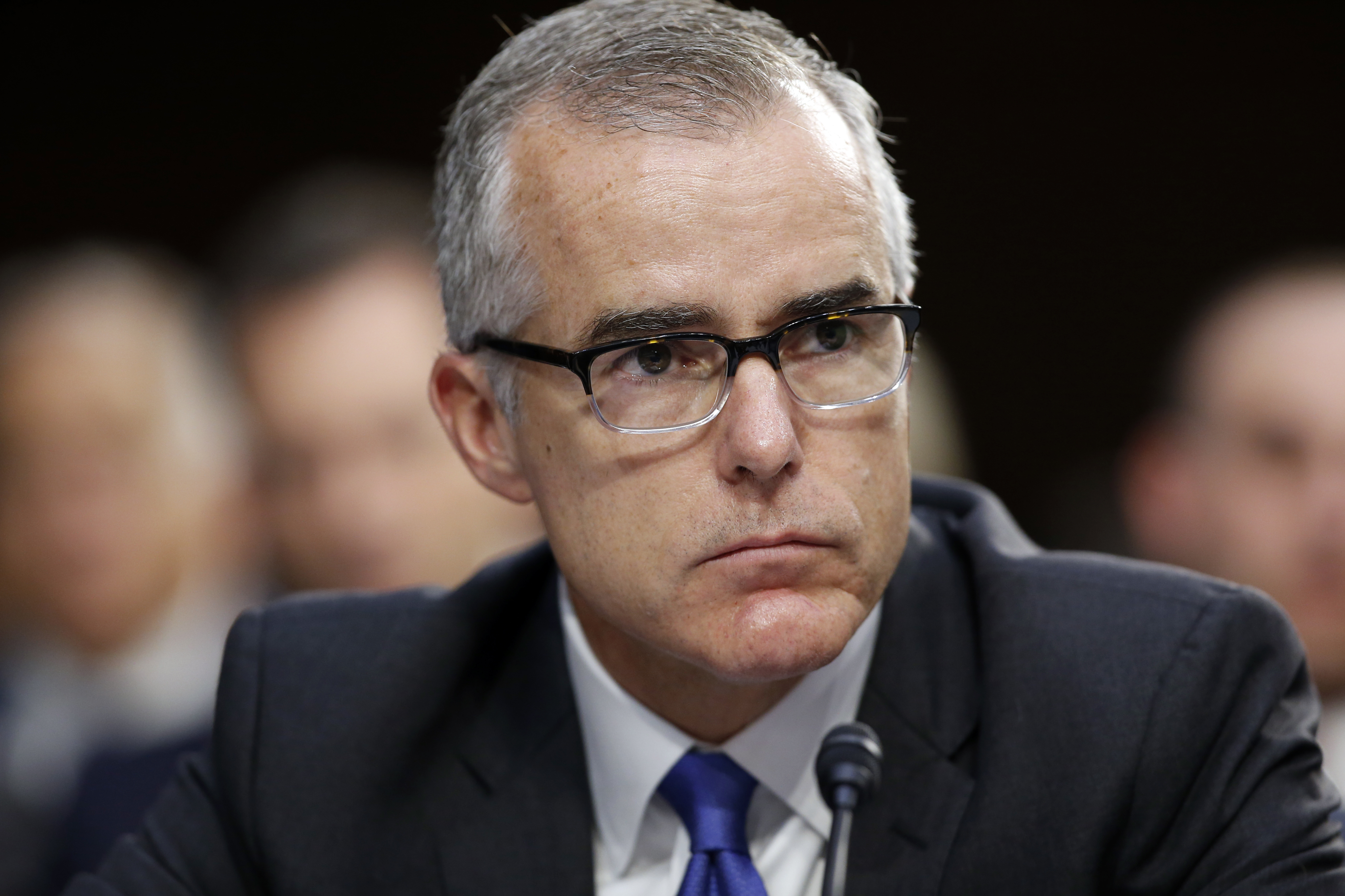 In this June 7, 2017, file photo, FBI acting director Andrew McCabe listens during a Senate Intelligence Committee hearing about the Foreign Intelligence Surveillance Act, on Capitol Hill in Washington. McCabe, the former FBI deputy director fired this year amid repeated attacks from President Donald Trump and a critical Justice Department report, has a book deal.