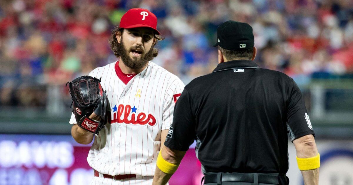 Philadelphia Phillies relief pitcher Austin Davis, left, talks with umpire Marty Foster, right, during the eighth inning Saturday against the Chicago Cubs in Philadelphia
