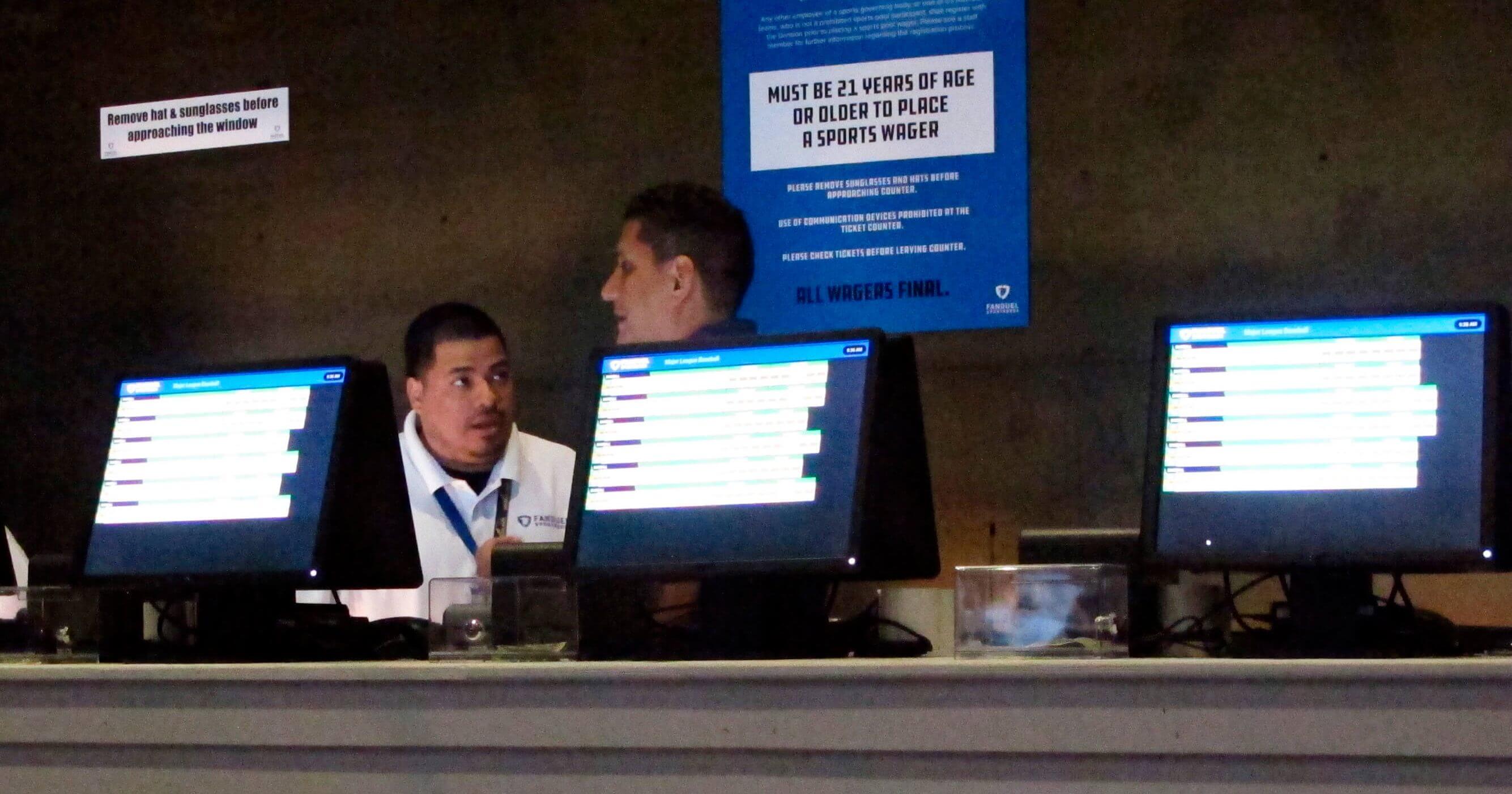 Workers at the FanDuel sports book at the Meadowlands Racetrack in East Rutherford, New Jersey, prepare to take bets moments before opening July 14.