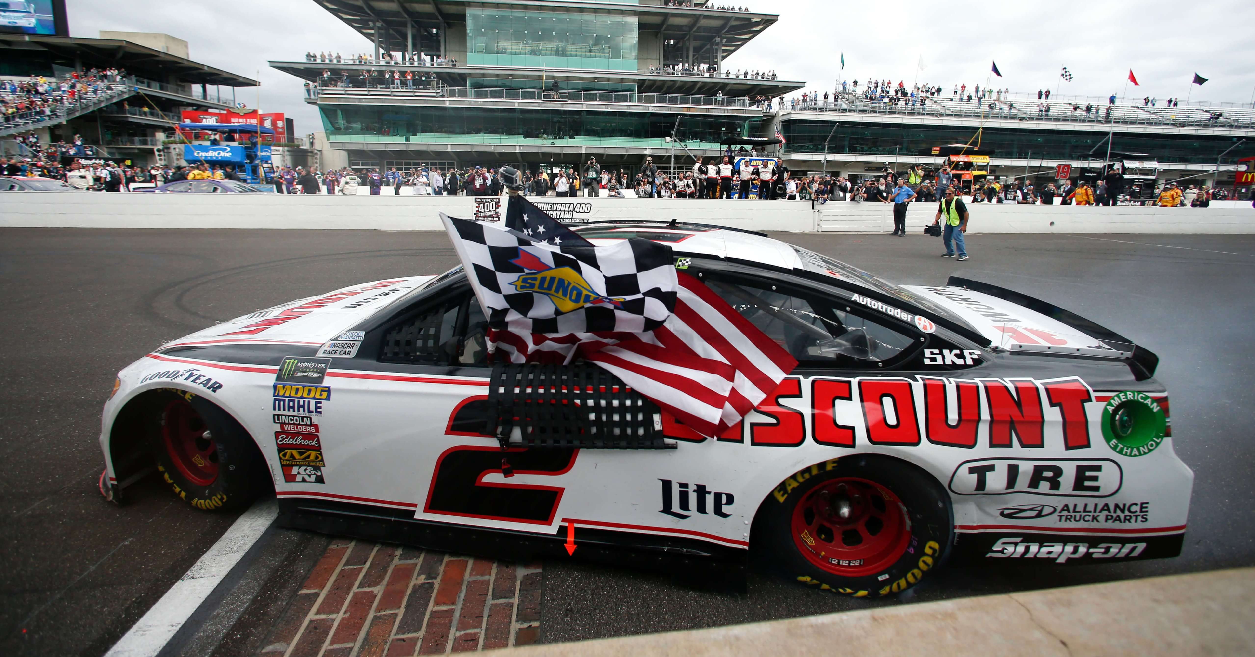 Brad Keselowski celebrates after winning the NASCAR Brickyard 400 auto race Monday at Indianapolis Motor Speedway.