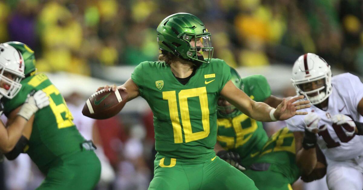 Oregon's Justin Herbert drops back to pass against Stanford Saturday in Eugene, Oregon.