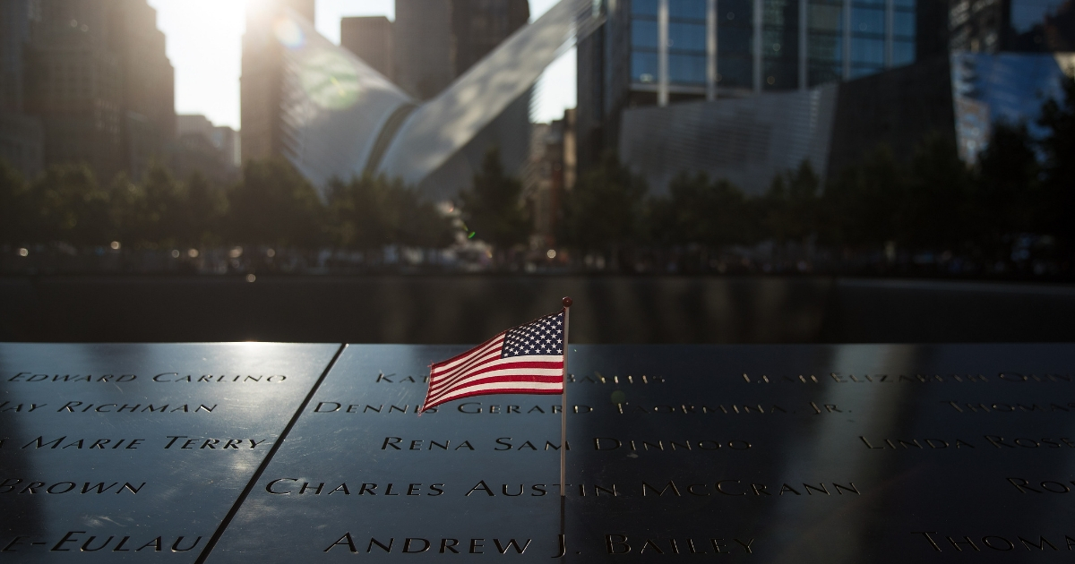 An American flag is left at the north pool memorial site before a commemoration ceremony for the victims of the Sept. 11, 2001, terrorist attacks at the National 9/11 Memorial in New York City.