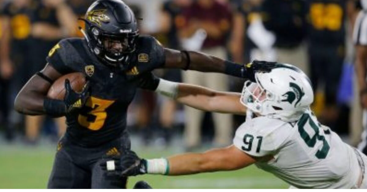 Arizona State running back Eno Benjamin (3) gives Michigan State defensive end Jack Camper (91) a stiff arm as he tries to get past during the second half of their game Saturday, Sept. 8, 2018, in Tempe, Ariz.