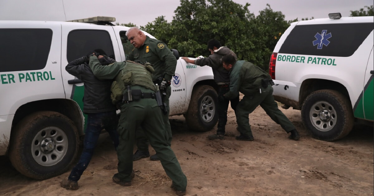 Border Patrol agents frisk illegal aliens arrested near McKallen, Texas, in February.