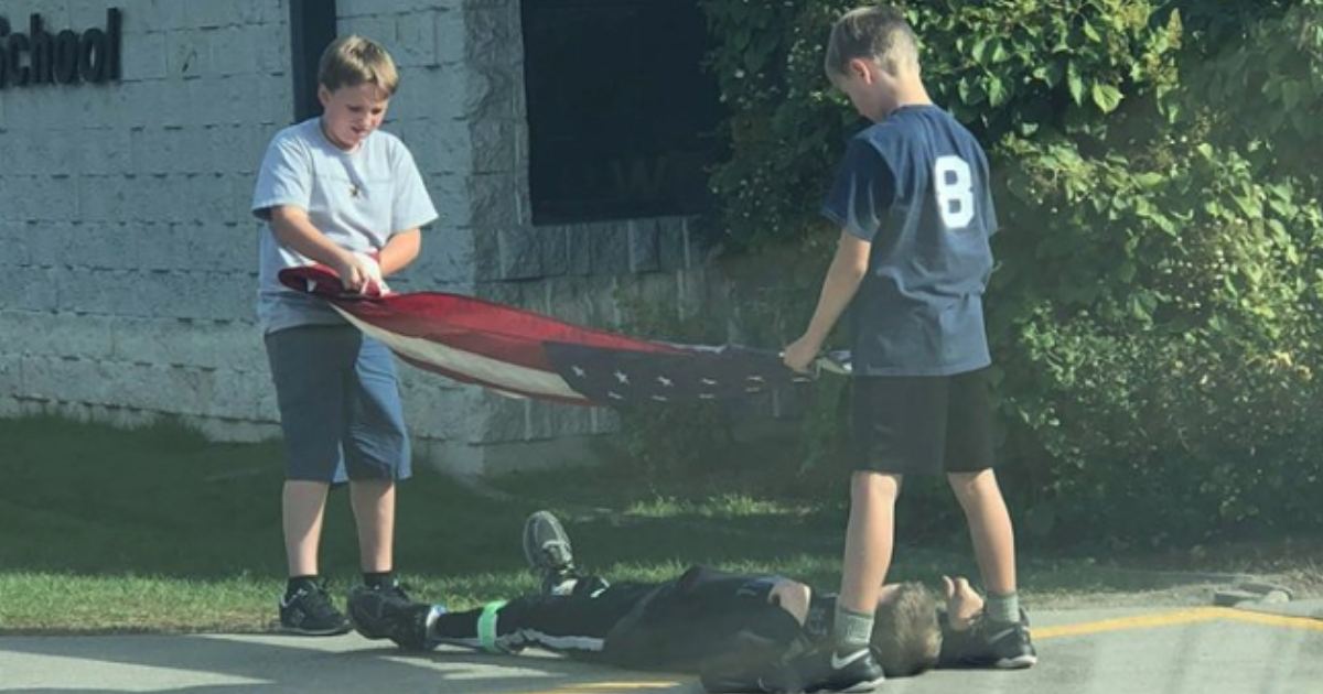 Boys Fold American Flag