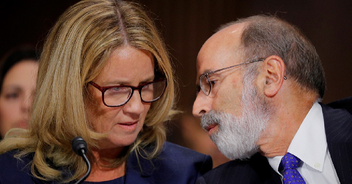 Christine Blasey Ford gets advice Thursday from Michael Bromwich, one of her attorneys, while appearing before the Senate Judiciary Committee.