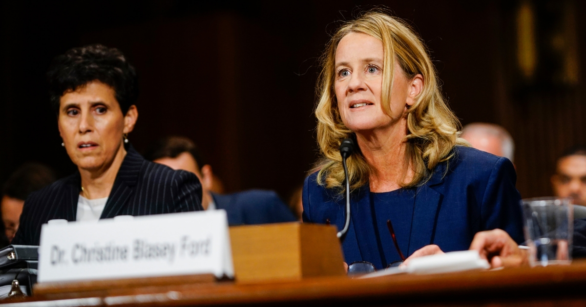 Christine Blasey Ford, with lawyer Debra S. Katz, left, answers questions at a Senate Judiciary Committee hearing on Thursday in Washington.