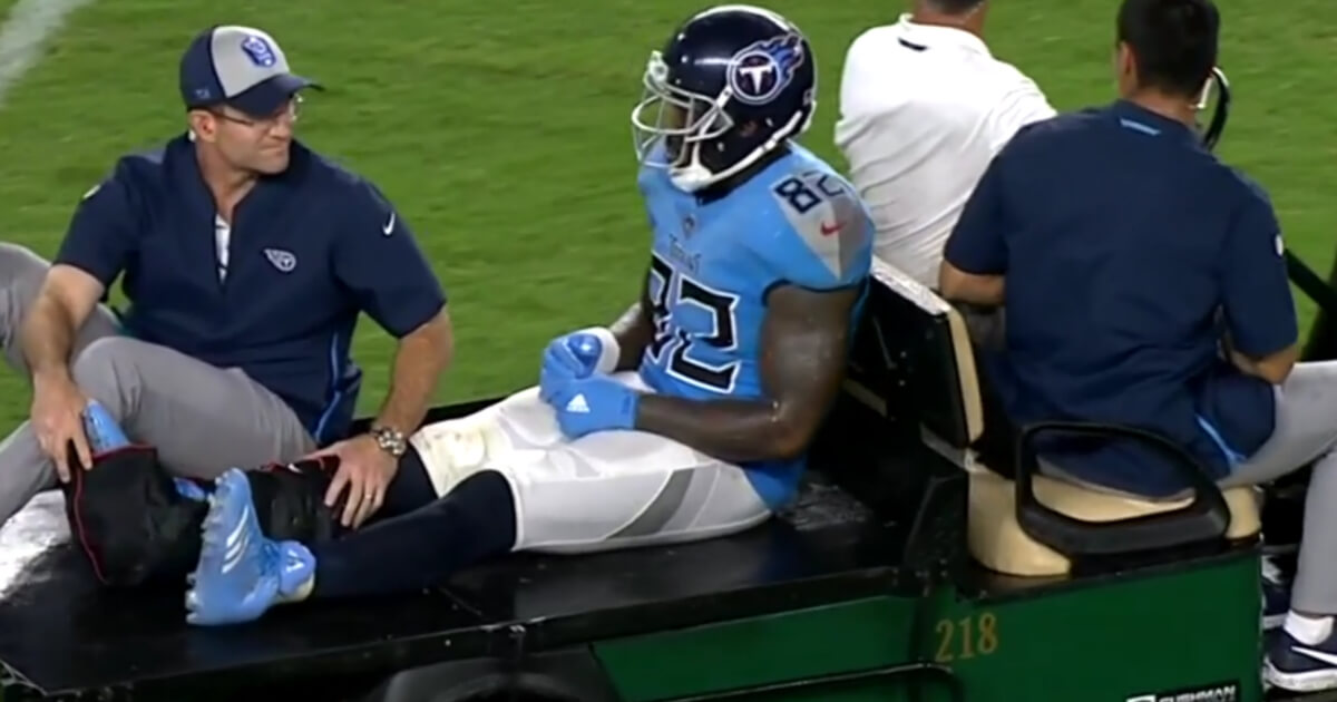 Titans tight end Delanie Walker is carted off the field after suffering a severe ankle injury in the team's season-opening loss at Miami.