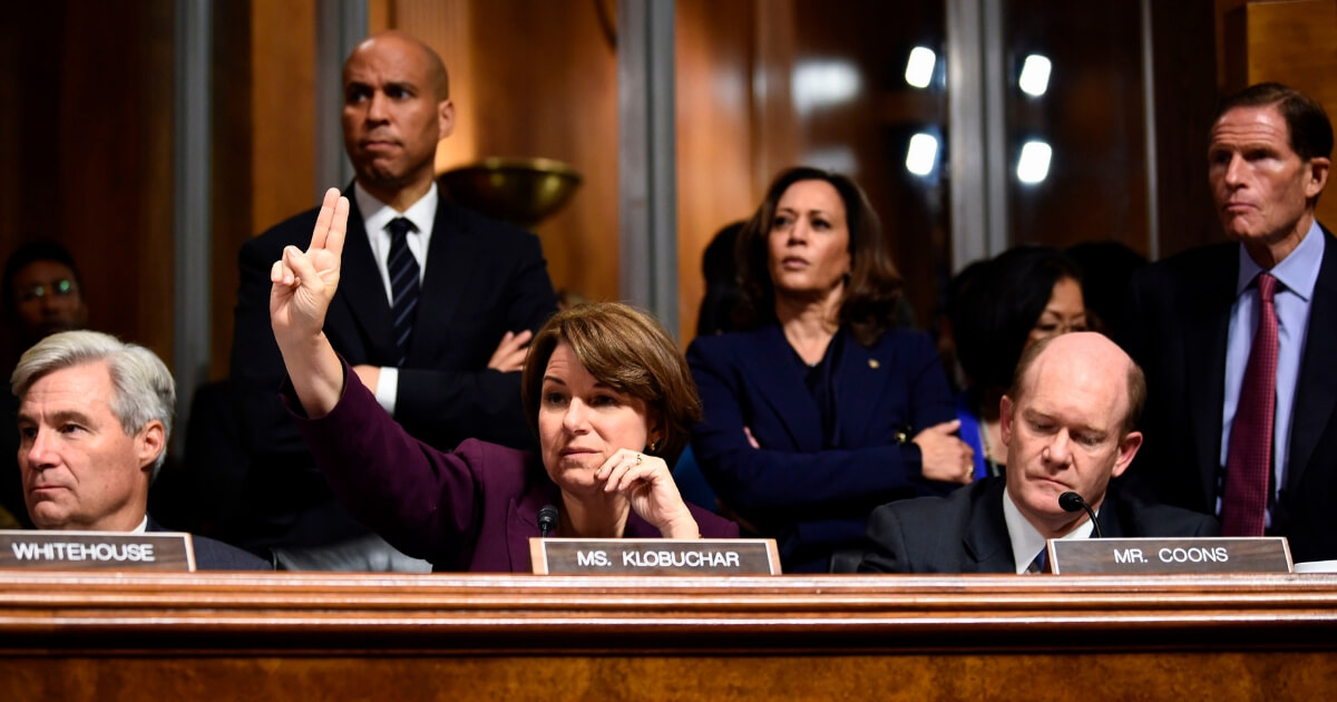 Senate Judiciary Committee members (L-R) Sheldon Whitehouse, Cory Booker, Amy Klobuchar, Kamala Harris, Christopher Coons, and Richard Blumenthal look on during a hearing on Capitol Hill in Washington, D.C. on Sept. 28, 2018.