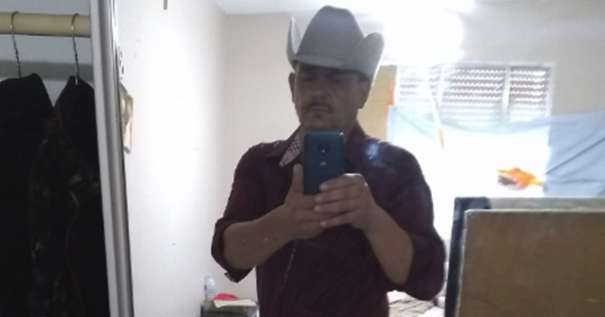 A man in a cowboy hat.