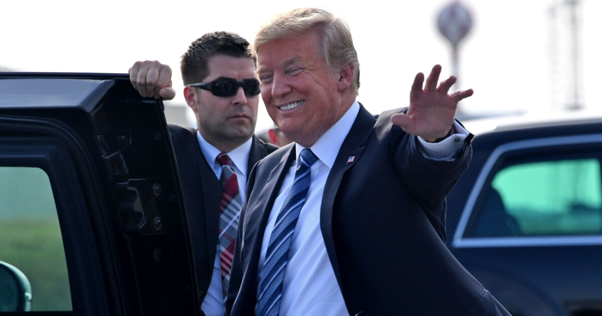 U.S. President Donald Trump waves as he arrives to Billings, Montana, for a rally on Sept. 6, 2018.