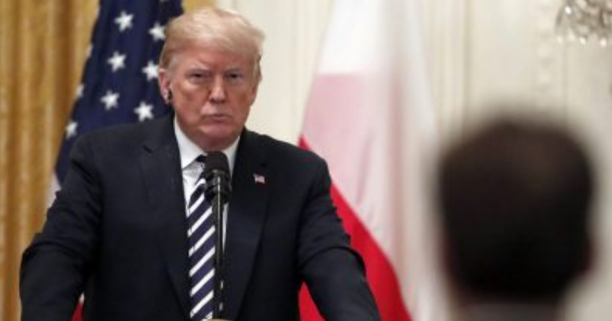 President Donald Trump listens to a reporter's question during a news conference with Polish President Andrzej Duda, in the East Room of the White House, Tuesday, Sept. 18, 2018, in Washington.