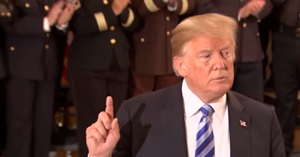 President Donaldl Trump got a round of applause from sheriffs at the White House on Wednesday after criticizing a New York Times anonymous op-ed purportedly written by a White House insider.