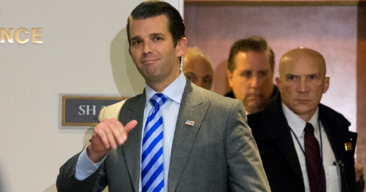 Donald Trump Jr. waves to the camera.