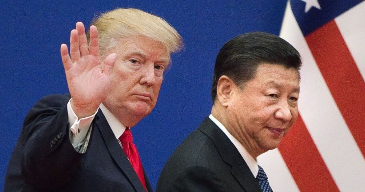 President Donald Trump, left, and China's President Xi Jinping at the Great Hall of the People in Beijing in November. (Nicolas Asfouri / AFP / Getty Images)