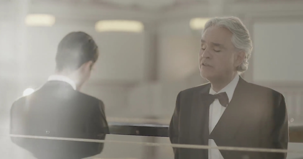 Andrea Bocelli and his son play the piano.
