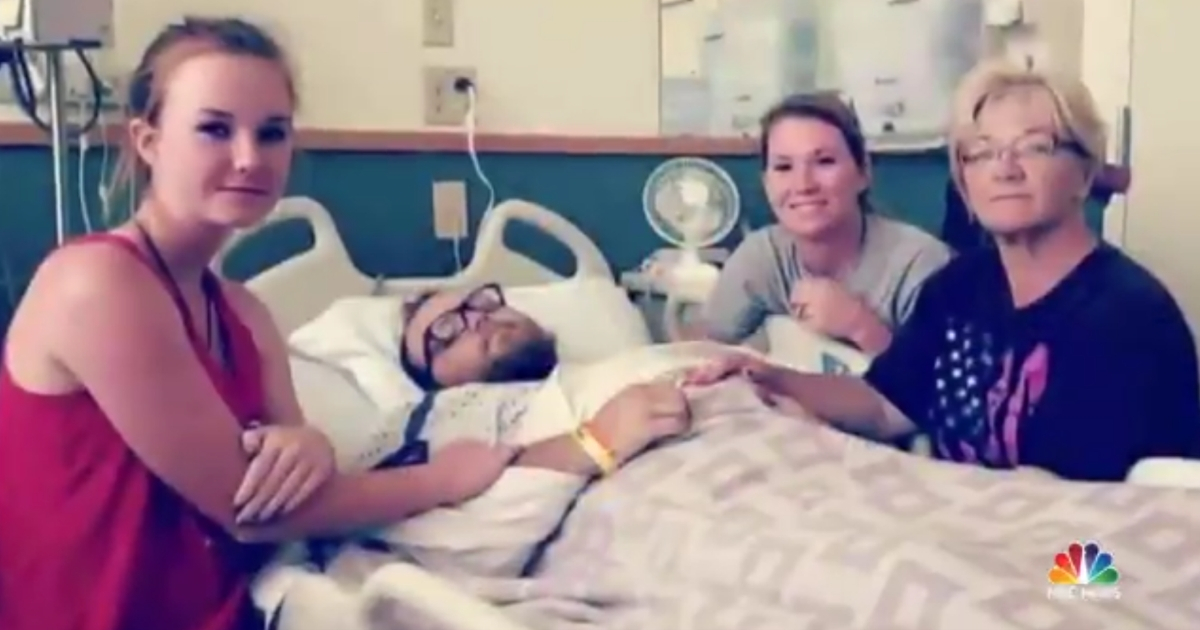 A family sits in the hospital with Matt Adams who was paralyzed after a car accident.