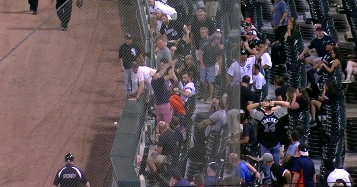 A fan sitting in the first row on the first base side at Guaranteed Rate Field was struck by Jeimer Candelario's foul leading off the Tigers ninth against the White Sox.