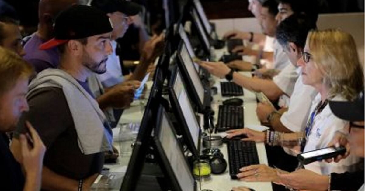 FanDuel customers place bets at the Meadowlands Racetrack in East Rutherford, New Jersey, in July.