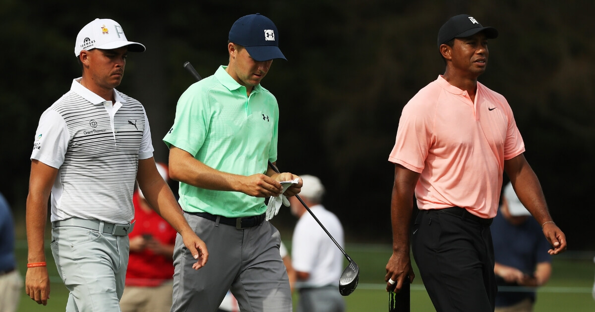 From left, Rickie Fowler, Jordan Spieth and Tiger Woods walk together Sept. 7 during the second round of the BMW Championship at Aronimink Golf Club in Newtown Square, Pennsylvania.