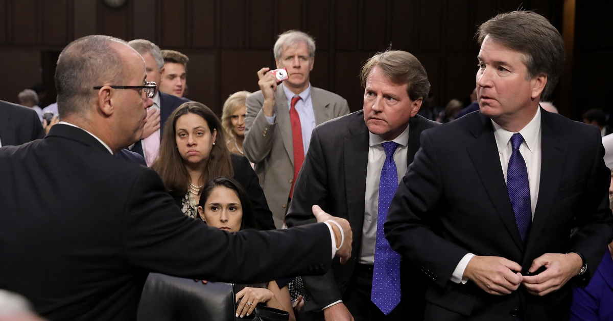 Fred Guttenberg, left, tries to shake Supreme Court nominee Judge Brett Kavanaugh's hand