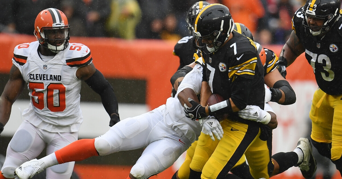 Myles Garrett of the Cleveland Browns sacks Ben Roethlisberger of the Pittsburgh Steelers on Sunday at Cleveland's FirstEnergy Stadium.