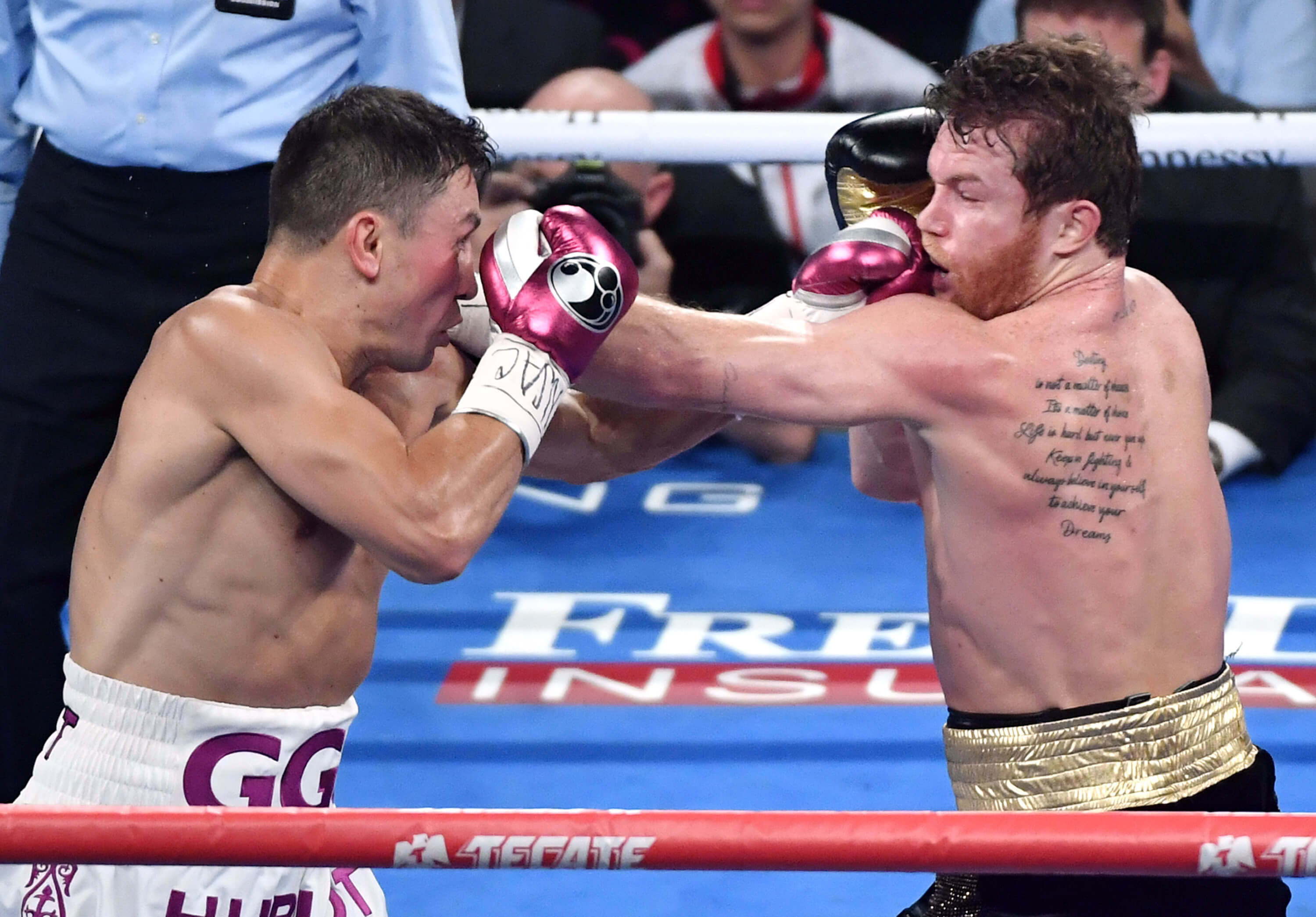 Gennady Golovkin, left, and Canelo Alvarez battle in the second round of their WBC/WBA middleweight title fight Saturday in Las Vegas, Nevada. Alvarez won by majority decision.