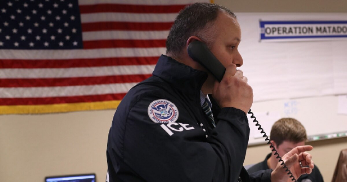 An Immigration and Customs Enforcement agent is pictured during a March illegal immigration crackdown in Central Islip, New York.