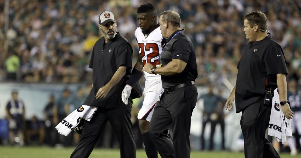 Atlanta Falcons' Keanu Neal is helped off the field after an injury during the first half against the Philadelphia Eagles on Thursday night.