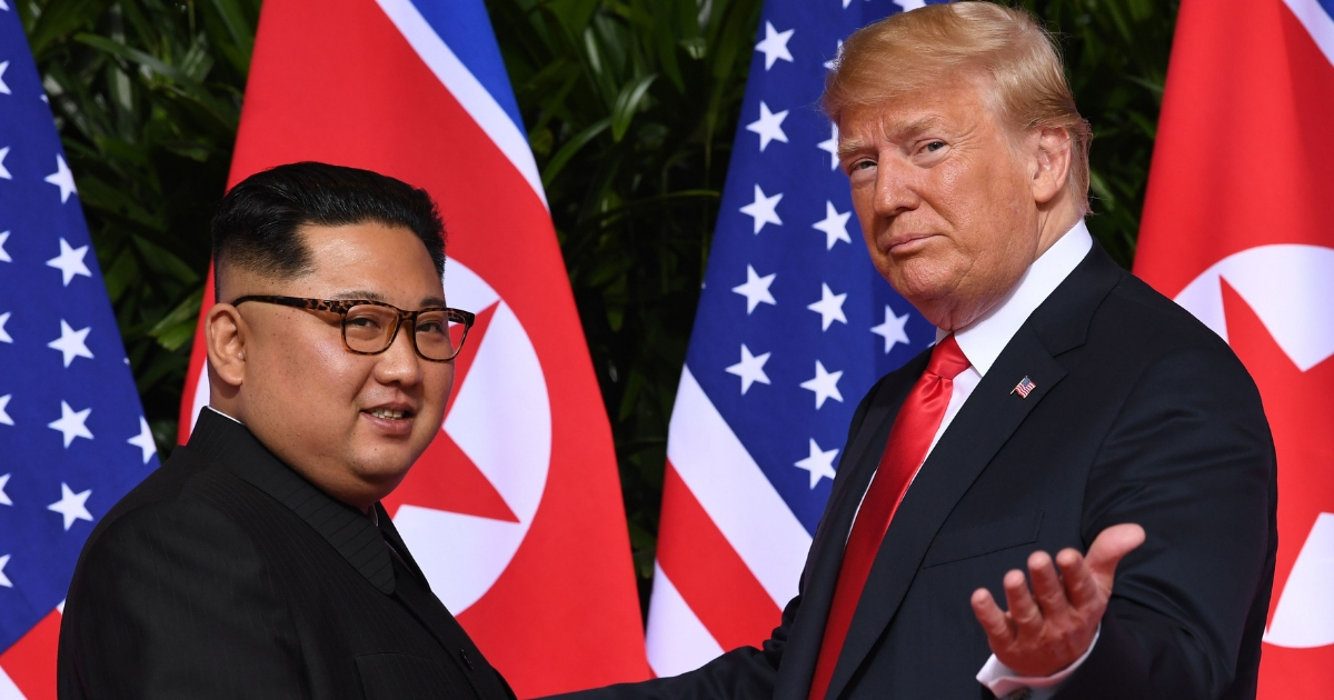 President Donald Trump, right, meets with North Korea's leader Kim Jong Un, left, at the start of their historic summit.