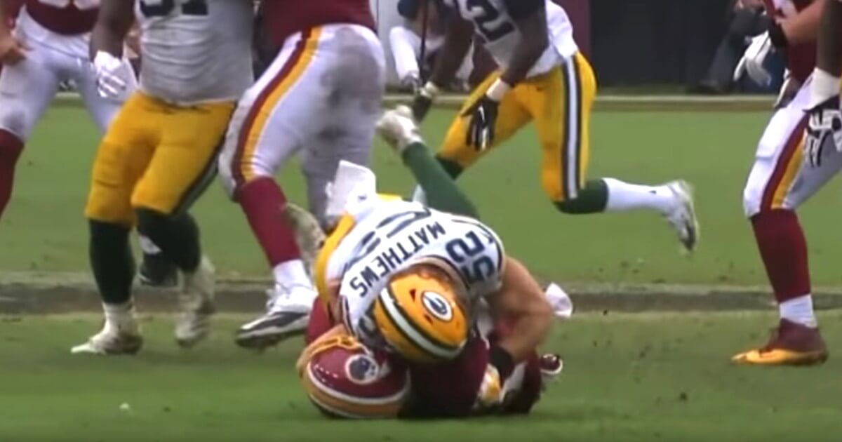 Green Bay Packers linebacker Clay Matthews was called for roughing the passer when he hit Washington Redskins Alex Smith.