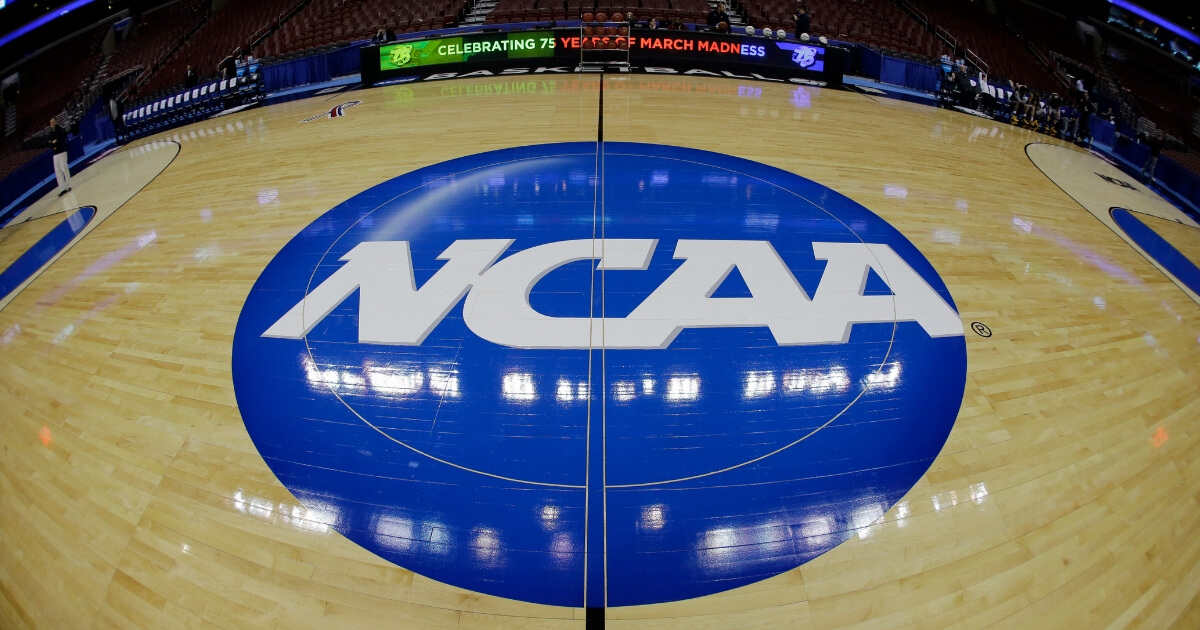 The NCAA logo is shown before a second-round game of the 2013 NCAA college basketball tournament in Philadelphia.