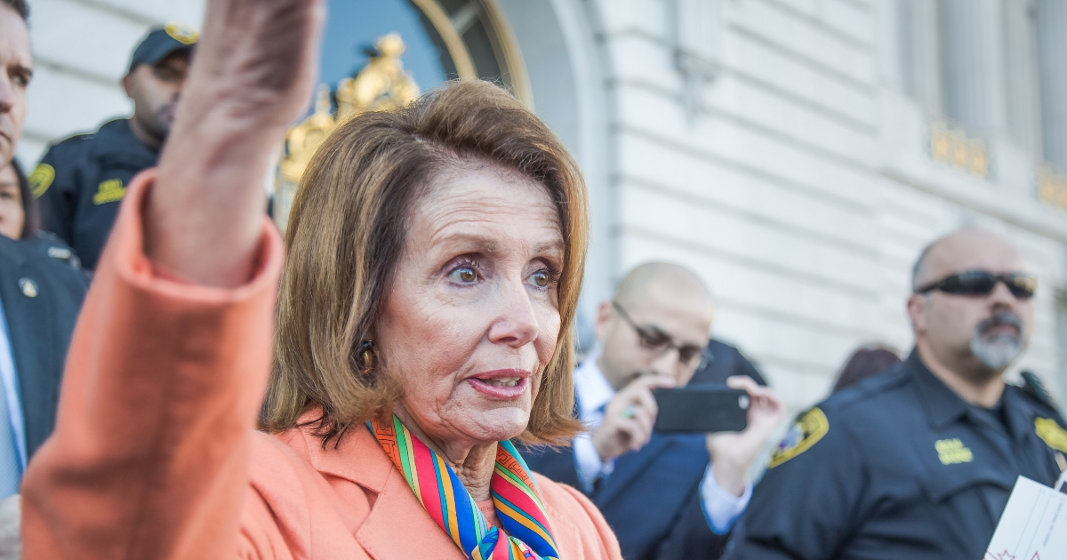 Nancy Pelosi speaks to constituents after a health care rally in San Francisco.