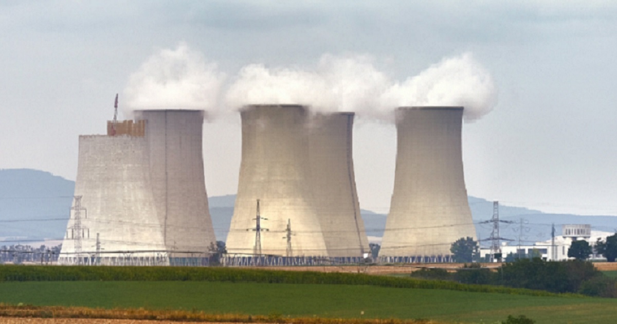 A nuclear power plant with three cooling towers.