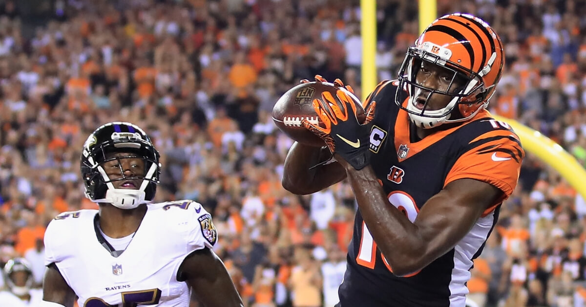 A.J. Green of the Cincinnati Bengals scores a touchdown against Tavon Young of the Baltimore Ravens in the first quarter Thursday night at Paul Brown Stadium in Cincinnati, Ohio.