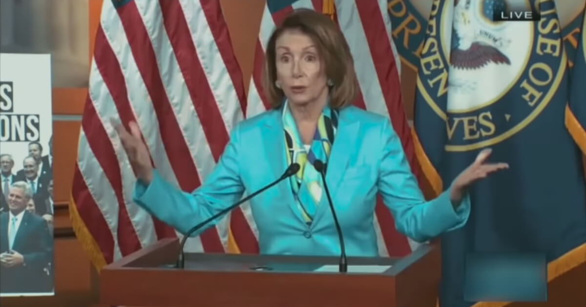 California Democrat Rep. Nancy Pelosi speaks from behind a podium