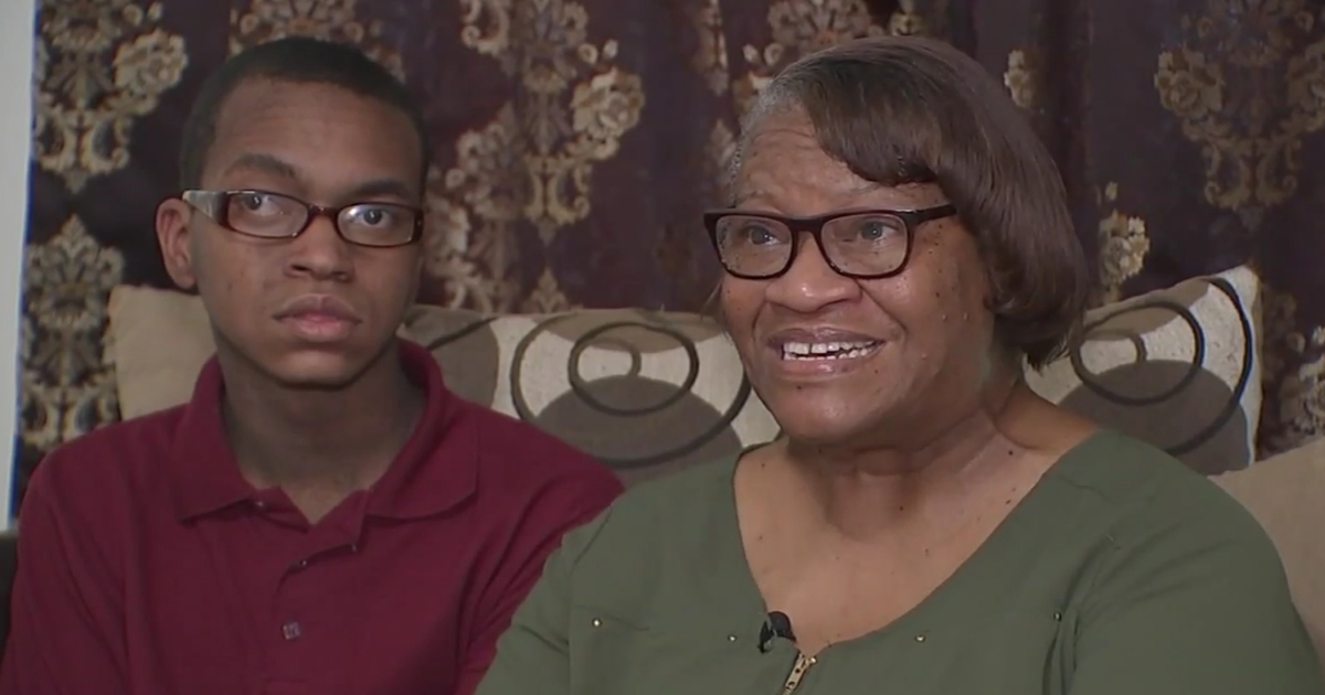 A retired teacher and her son talks to the camera