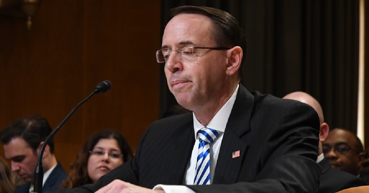 Rod Rosenstein grimacing at a table.
