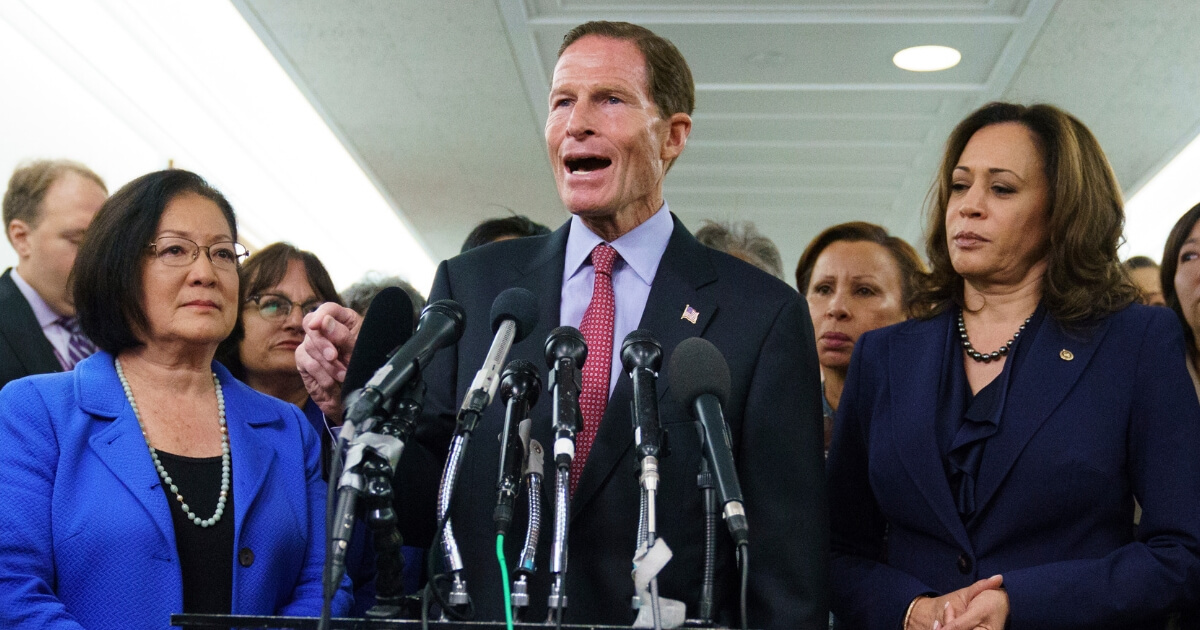 Senate Judiciary Committee member Sen. Richard Blumenthal, D-Conn., joined by Sen. Kamala Harris, D-Calif., right and Sen. Mazie Hirono, D-Hawaii, left, speaks to media about the Senate Judiciary Committee hearing on Judge Brett Kavanaugh, President Donald Trump's Supreme Court nominee, on Capitol Hill in Washington, Sept. 28, 2018.