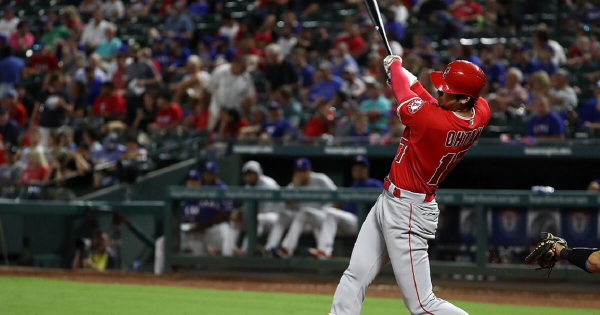 Los Angeles Angels star Shohei Ohtani hits a home run against the Texas Rangers on Wednesday.