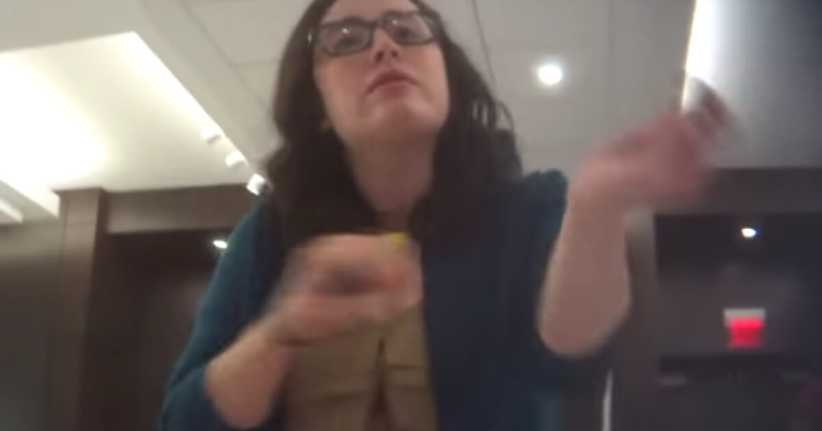 A woman identified as Department of Justice paralegal Allison Hrabar talks into a hiddent camera in a screen shot from the Project Vertias video "Deep State Unmasked."