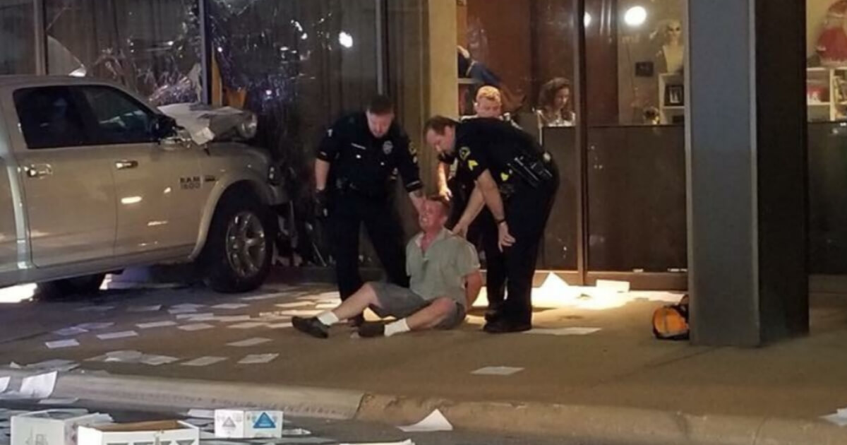 The man suspected of ramming his truck into a Fox-owned TV station in Dallas is detained by police.