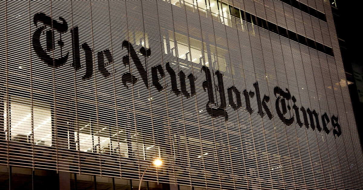 The New York Times headquarters at night.