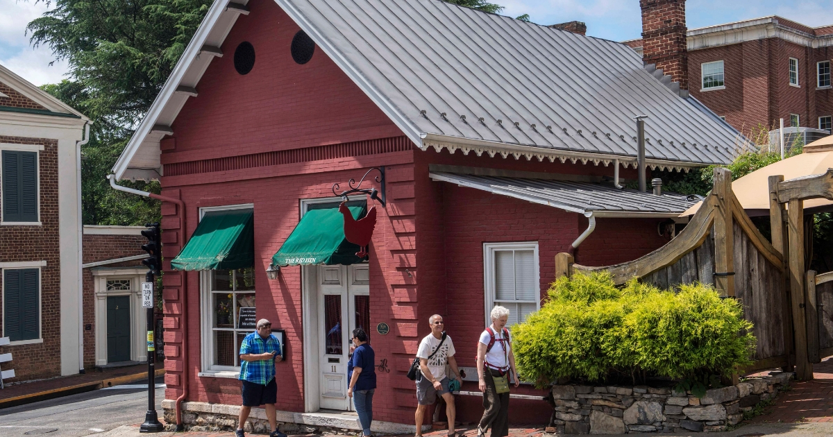 People walk past the Red Hen restaurant in Lexington, Virginia, Wednesday, June 27, 2018.
